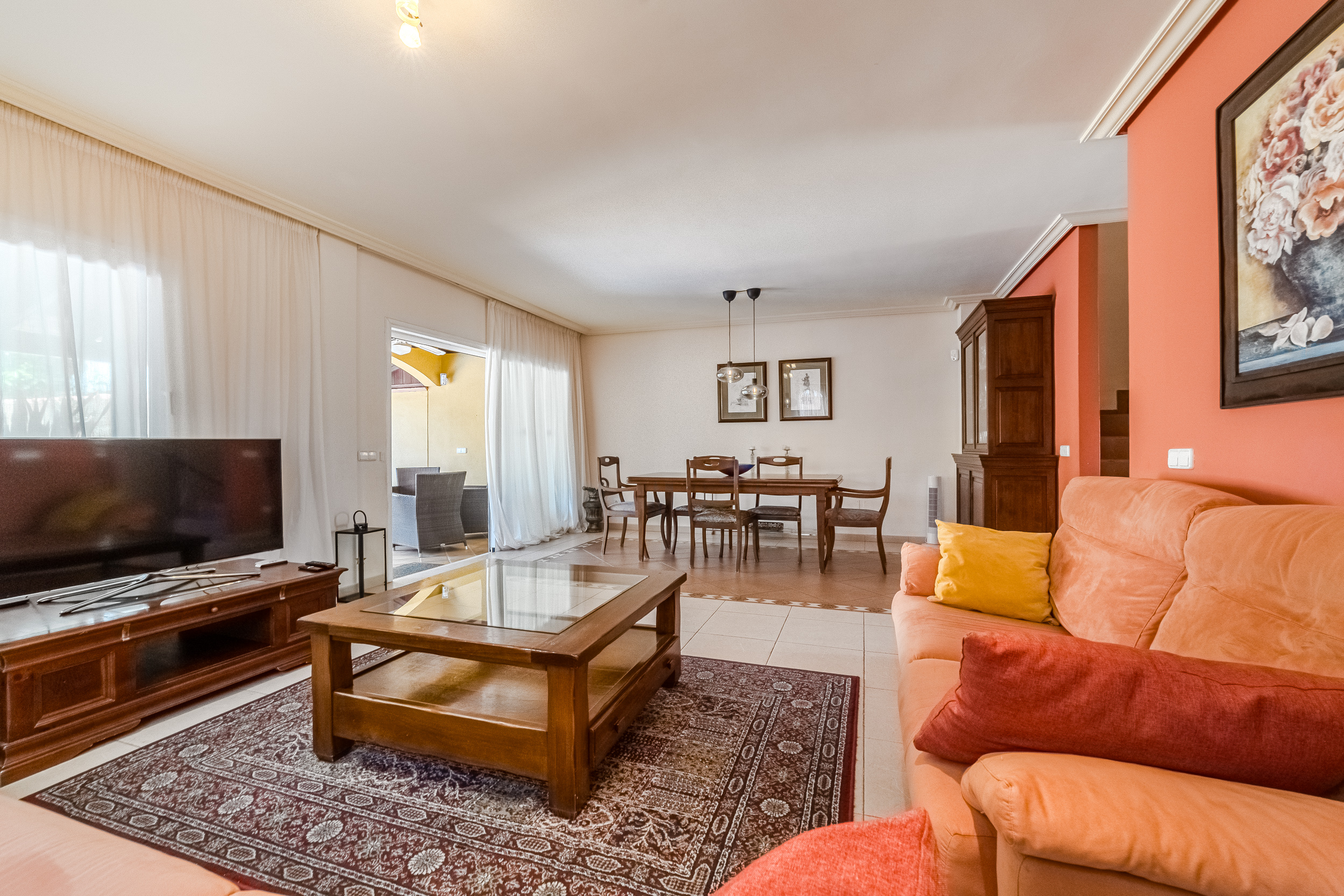 Living room with sliding doors open to the terrace
