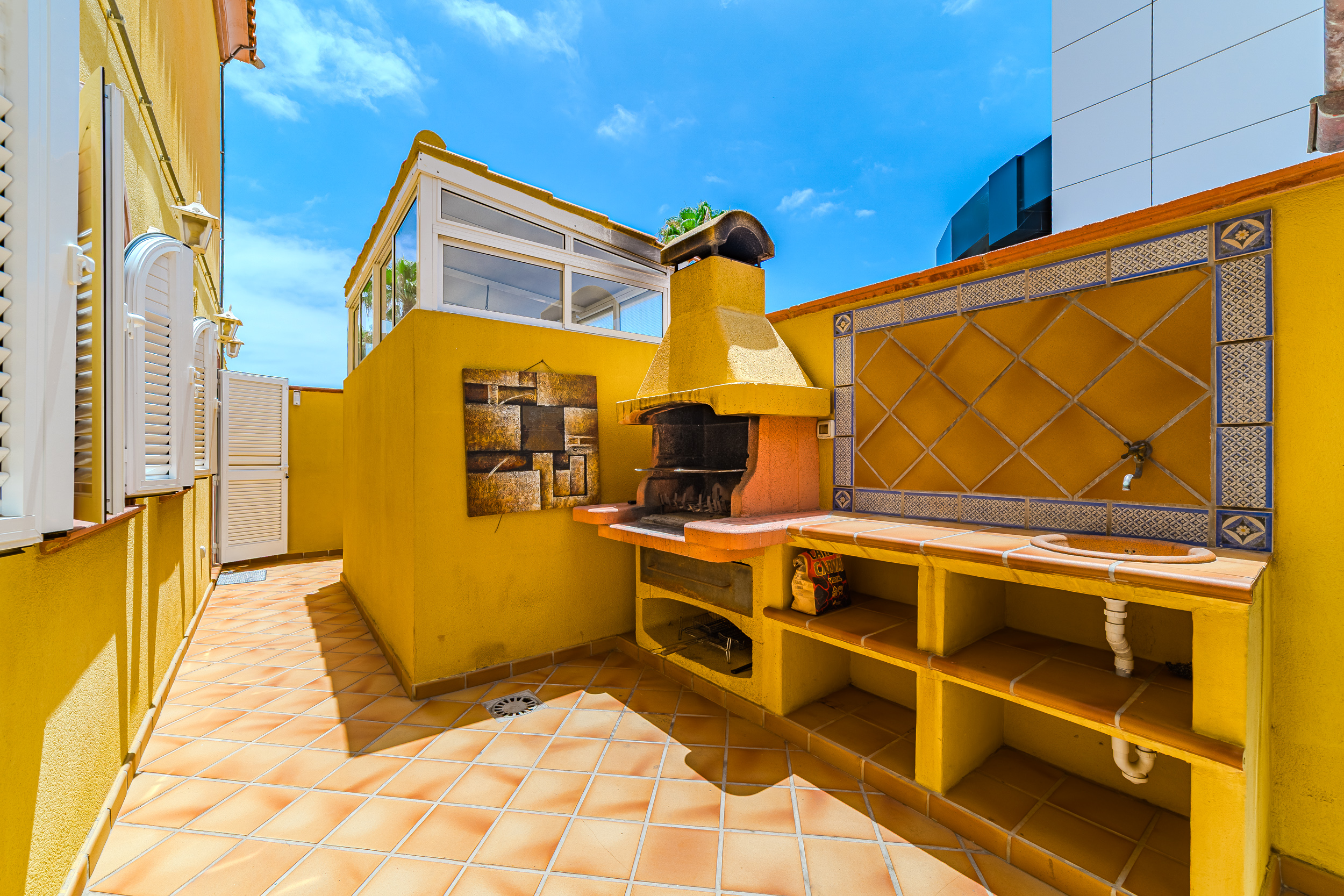 Barbecue terrace with built-in grill and sink